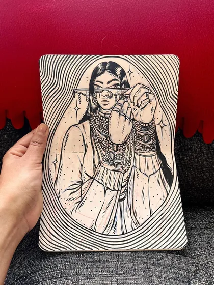 A sketchbook drawing of a woman from the Rabari tribe of India.