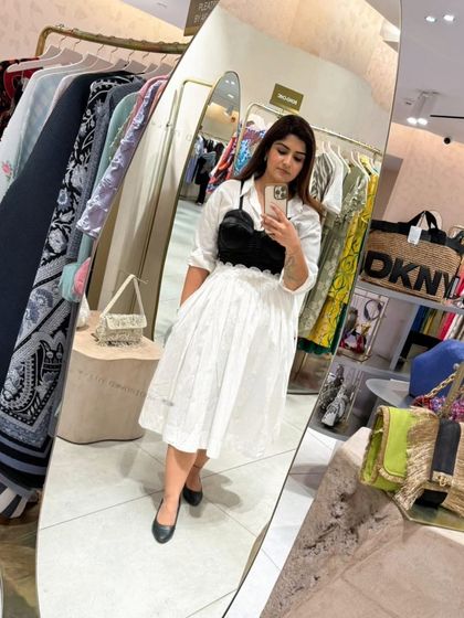 A mirror selfie capturing the complete look, perfect for a chic day out or a semi-formal event.