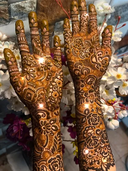 A beautiful shot of a full bridal mehendi, sparkling in the light. The design is packed with intricate details.