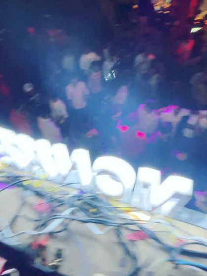 A blurry, action packed shot from the DJ booth at Blurred X Party Monkeyz, capturing the chaos of a great party.