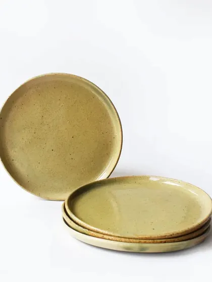 A set of our classic side plates in a warm, earthy lemon-green glaze with subtle speckles. These versatile plates are perfect for everyday meals, salads, or desserts.