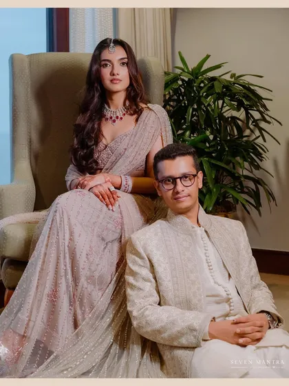 A regal and composed portrait. I styled this shot to feel like a modern royal painting, with the bride seated elegantly in a wingback chair and the groom positioned beside her, exuding quiet confidence.