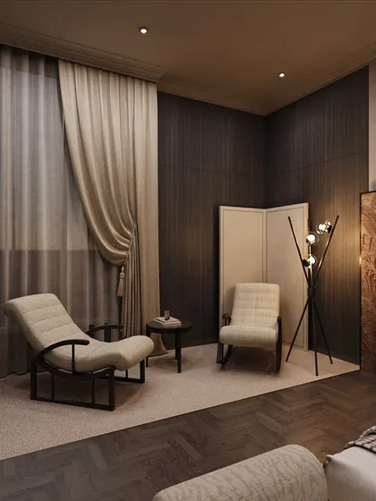 The full reading corner, complete with a comfortable chaise lounge and a side table. Heavy curtains add to the sense of intimacy and comfort.