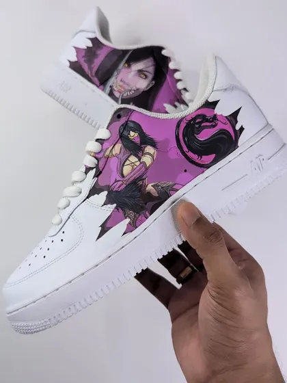 Holding up the Mileena AF1. The design shows her in a fighting stance on one side and a menacing close-up on the other.