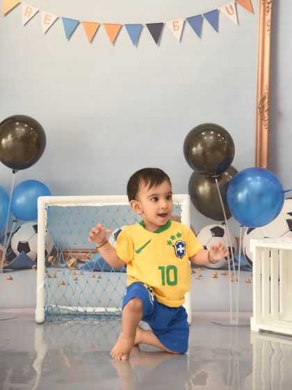 On his knees and ready to play. This football theme brings out the energetic and playful side of toddlers.