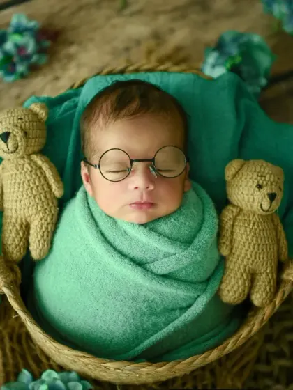 A touch of whimsy for this little scholar. I love adding small, creative props like these tiny glasses to bring out a unique personality in each newborn session.