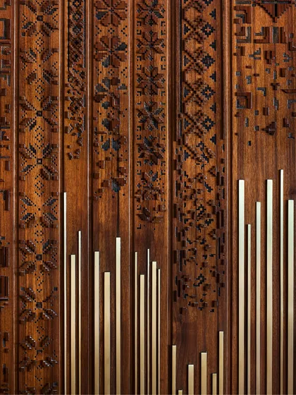 This hand-carved wooden panel with brass flute inlays represents the fusion of tradition and innovation. I believe craftsmanship is a narrative device, and every detail here connects people to the space through a story of history, material, and artisanal skill.