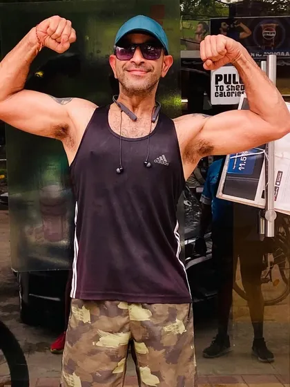 A member showing off his gains. Cycling is a fantastic way to build strength and endurance.