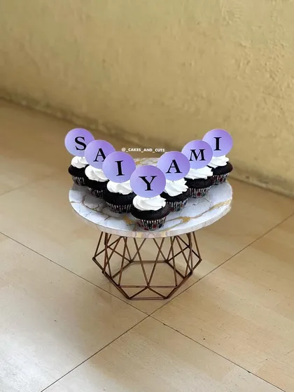 Another view of the personalized "SAIYAMI" cupcakes on a beautiful marble plate.
