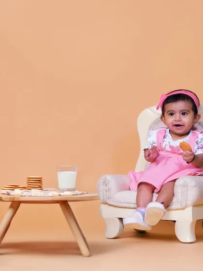 A sweet and simple studio setup with milk and cookies. This theme creates a cozy and adorable portrait, capturing a classic childhood moment.