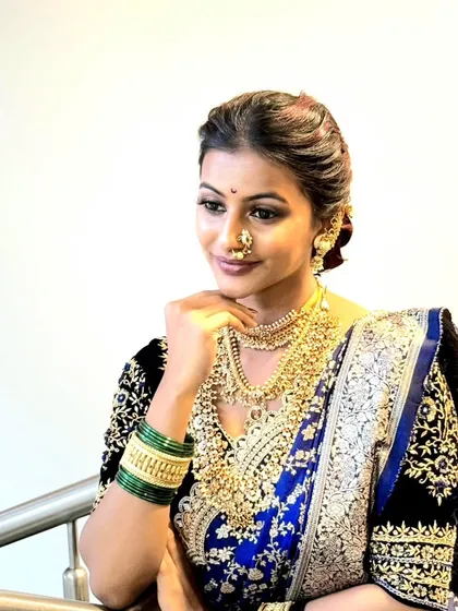 A close-up portrait capturing the elegance of the Navari drape. My services often include makeup and hair, allowing me to create a complete, harmonious look that enhances the beauty of the saree.