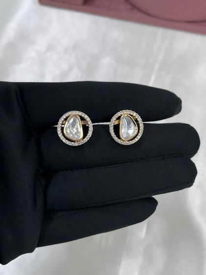 A close-up of the simple yet elegant stud earrings that come with our lightweight necklace sets. These are perfect for daily wear.