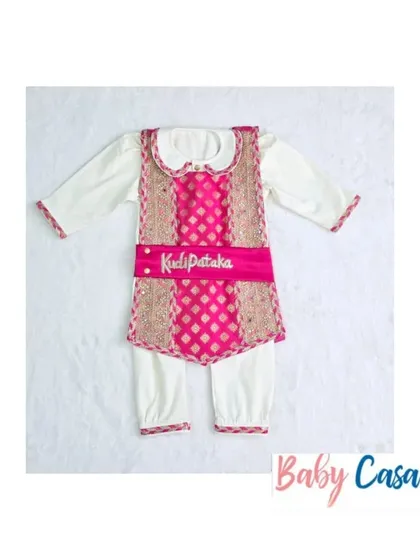 'Kudi Pataka' romper set. For the little girls who are full of life, this indo-western set with a pink brocade vest is a fun and festive choice.