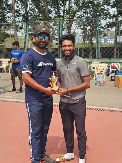 Presenting a trophy to one of our victorious men's team players.