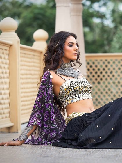 A close-up on the mirror-work blouse and heavy jewellery from the Sajeda Lehry campaign, highlighting the detailed craftsmanship.