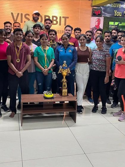 Posing with the team and our trophies. Every victory is a shared one.