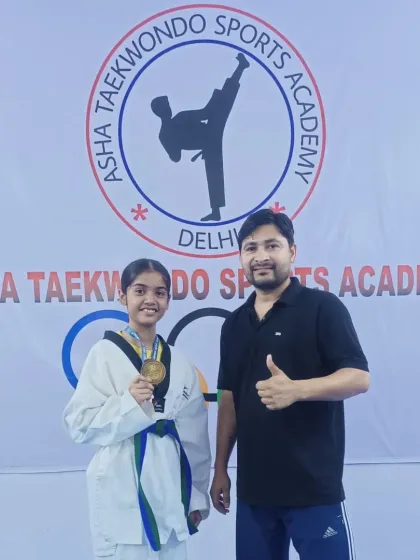 I am always proud to stand with my students after their victories. Here is Aliya with her well-deserved gold medal.