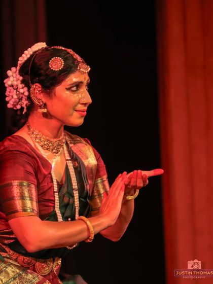 A playful, communicative gesture from a traditional 'padam' or 'javali', where the dancer often tells a story of love and courtship.