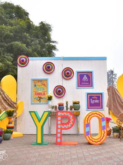 A branded photo wall for a YPO corporate event with a fiesta theme. The large letters and colorful backdrop create a perfect, on-brand photo opportunity.