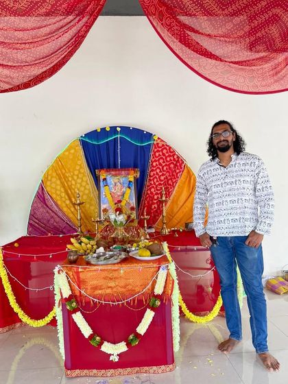 Standing beside the altar where my watercolor painting of Maa Durga was placed for Navratri worship.