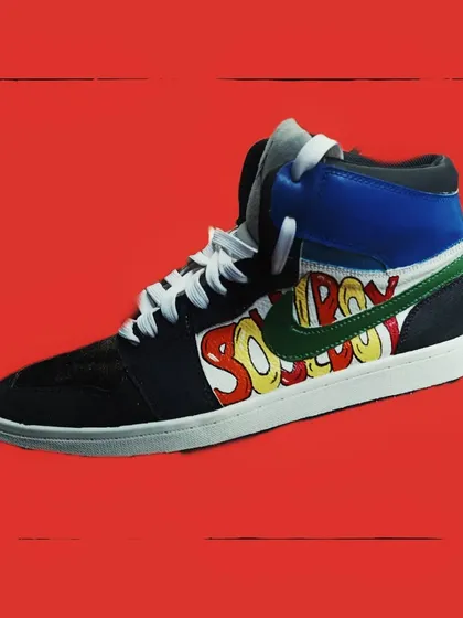 A close-up of the graffiti-style design on the other sneaker. The bubble letters and bright color palette give it a fun, street-art inspired look.