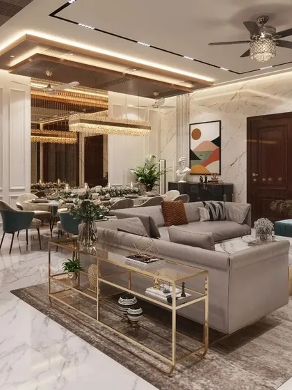 Every corner tells a story. This open-plan living and dining area shows how we integrate different functions, from dining to relaxation, into one cohesive and luxurious space, complete with a view of the home's serene temple area.