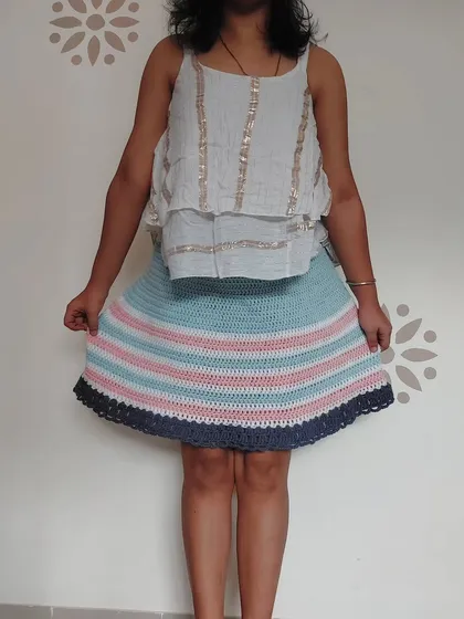 This is my Frilly Billy Skirt, a fun and flirty piece that shows how I play with color and texture. The A-line shape and ruffled hem are fully customizable, ensuring a perfect, made-for-you fit.