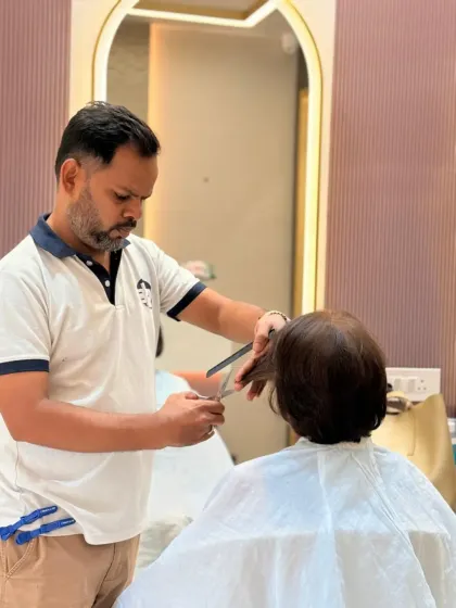 Passion and perfection. One of our expert stylists, Pravin, focused on giving a client a precision haircut.