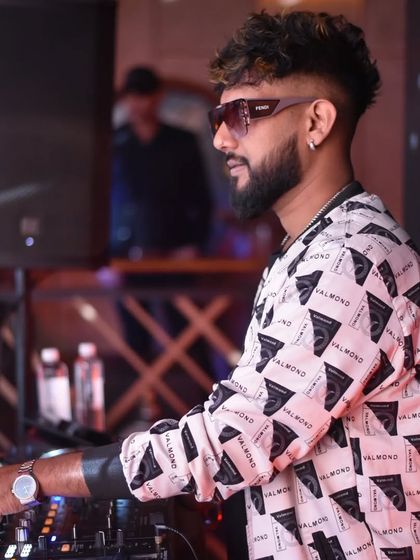 A side view of me working the decks. Self-confidence is key to success in this industry.