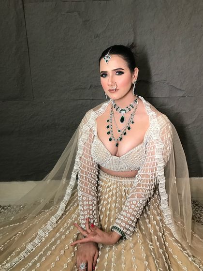 Another shot of this modern and chic reception look. The focus is on the dramatic eyes and flawless skin.