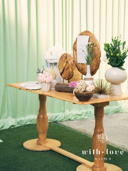 A guest message station at the baby shower, with elegant wooden decor.