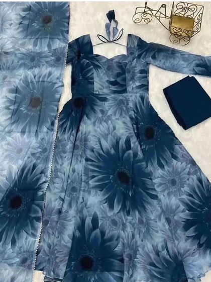 A deep blue Anarkali suit fabric with a large sunflower print. We can create a bold and beautiful statement dress from this material.