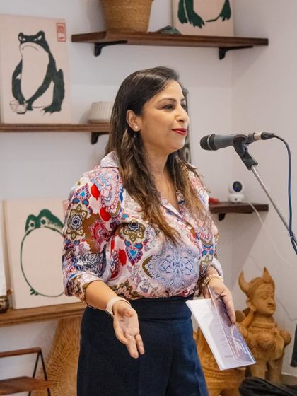 A performer sharing her work at our Saturday Open Mic. These weekend sessions are a perfect way to unwind and immerse yourself in creativity.