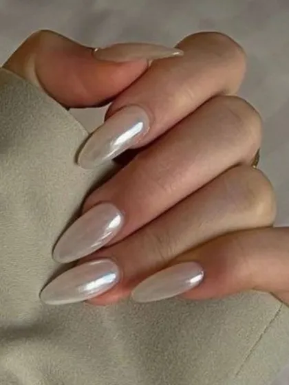 Another example of the beautiful and subtle glazed donut look. This pearly chrome finish looks amazing on long stiletto nails.