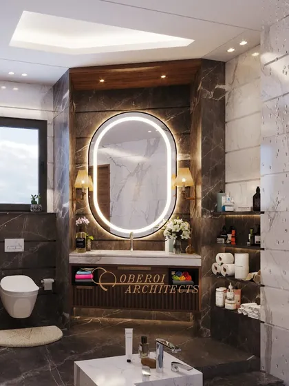 The main vanity area features a large, backlit oval mirror and ample storage, combining functionality with high-end aesthetics.