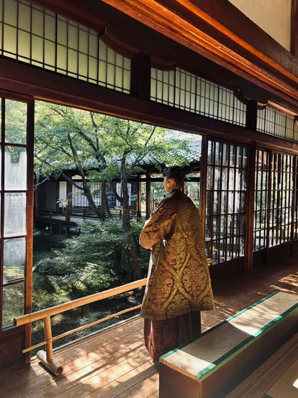 A reflective moment overlooking a Japanese garden, my outfit blending with the serene environment.