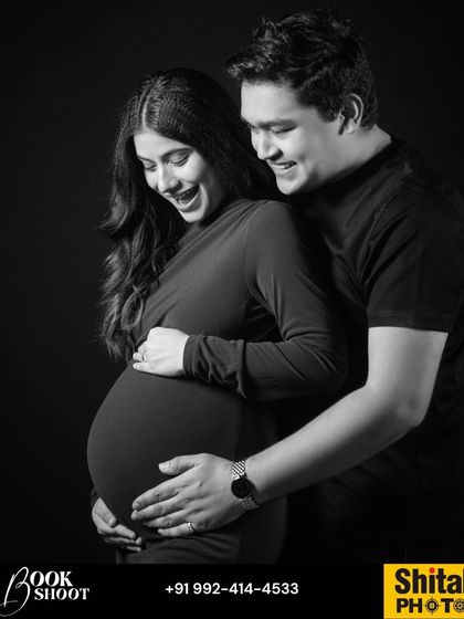 Laughter and joy are a huge part of the pregnancy journey. This black and white portrait captures a moment of shared happiness, creating a memory that is both beautiful and authentic.