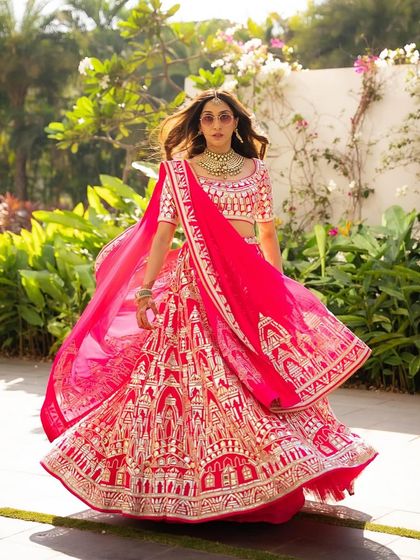 Anissa looking absolutely radiant while twirling in her vibrant Abu Sandeep lehenga. The makeup is fresh and luminous, perfect for a sun-filled outdoor celebration.