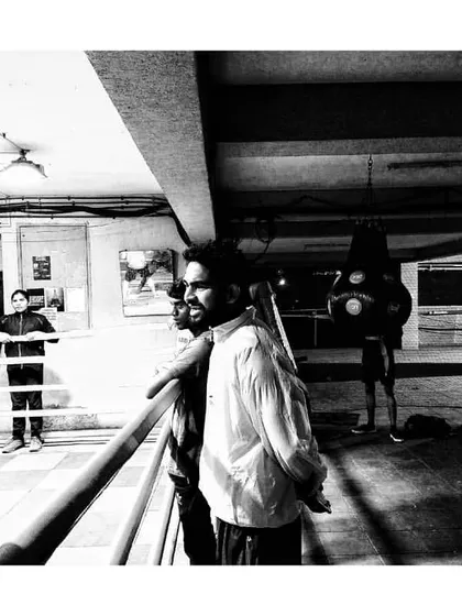 Coach Anuj Kumar Singh watching over a sparring session. His sharp eye catches every detail, ensuring our boxers are technically sound and strategically prepared.