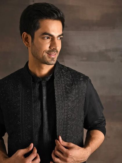A classic menswear look I styled for an Indian couture campaign. The all-black ensemble, featuring an embroidered bandhgala jacket, is a testament to timeless elegance in men's festive fashion.