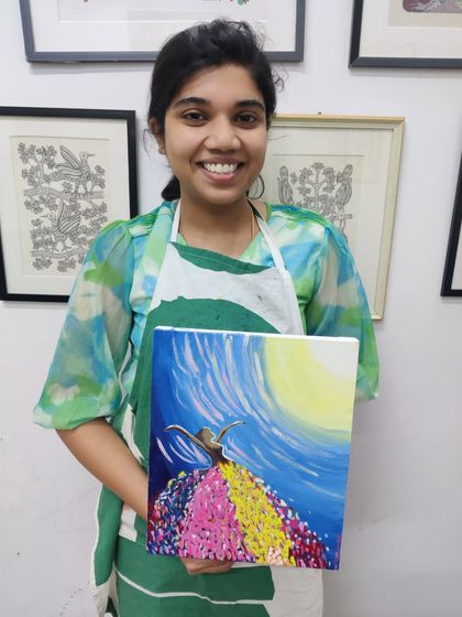 A collection of happy students from our adult canvas painting workshop, each holding their unique and beautiful landscape and abstract creations.