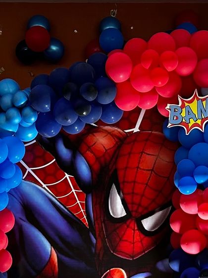 A close-up of a Spiderman backdrop with a "BAM!" comic book graphic. The vibrant colors and bold design are perfect for a superhero theme.