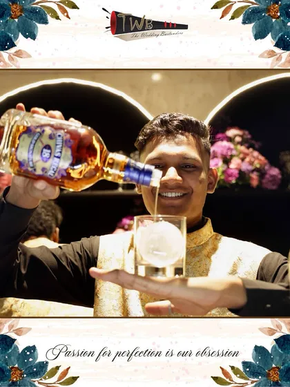 A bartender proudly pours a glass of Chivas Regal, highlighting the premium spirits we work with.