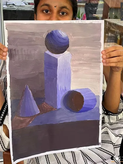This student is mastering the fundamentals of form and value with a monochrome study of geometric shapes, a key exercise in our curriculum.