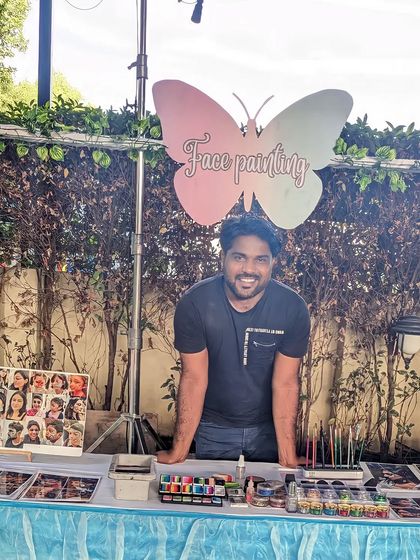 Me at my booth, all set up and ready to paint at a beautiful outdoor wedding event.
