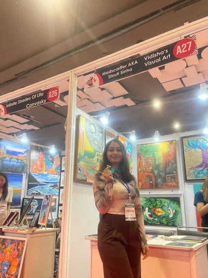 This is me at my booth at 'The Haat of Art'. It was a lifetime experience meeting other incredible artists and seeing people of all ages light up over my work, especially the handcrafted magnets and bookmarks.