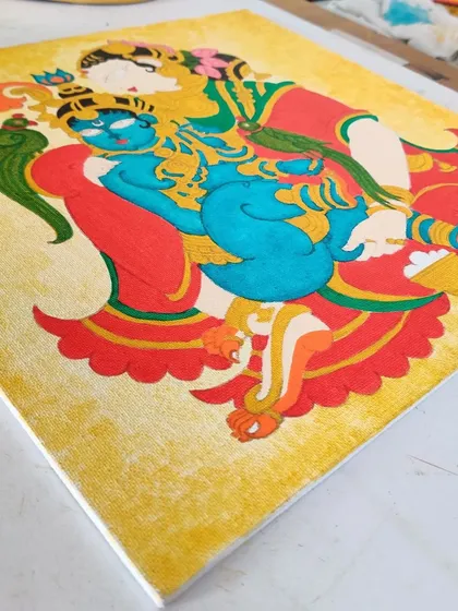 The Yashodakrishna painting with more colors added, including Krishna's blue skin and the green parrot.