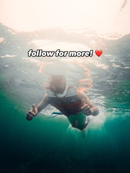 A shot of me giving a thumbs-up while snorkeling in Bali. Follow me for more travel adventures and tips.