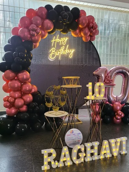 A full view of the black and red chrome 10th birthday decoration.