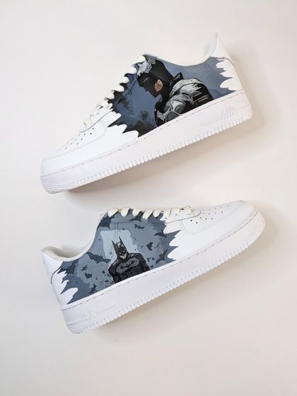 Can't go wrong with the Dark Knight. This Batman-themed Air Force 1 features two different portraits of Batman against a gloomy Gotham sky.